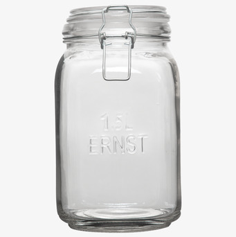 Bild av stilren glasburk med spännlock och präglad text