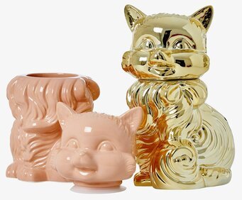 Bild av lyxiga keramikburkar i guld och persikorosa