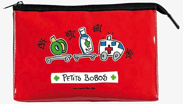 Bild av röd medicinväska med lekfulla illustrationer