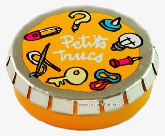 Bild av rund plåtburk med orange och silver design