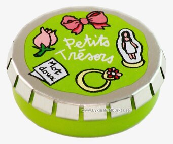 Bild av kompakt grön plåtburk med lekfull design