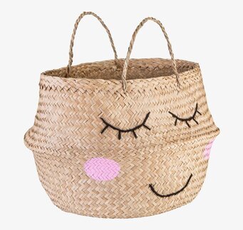 Bild av flätad förvaringskorg med stiliserat ansikte