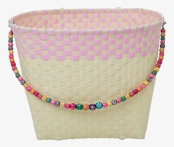 Bild av plåtburk med pastellfärger och pärldetaljer