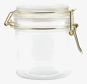 Bild av elegant glasburk med gyllene metallspänne