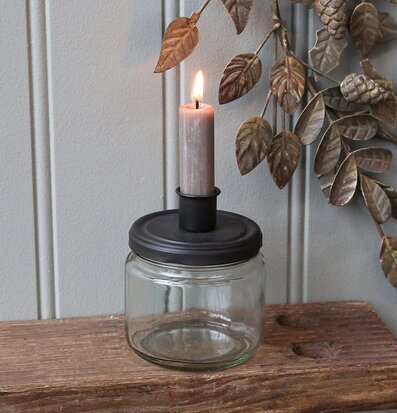 Bild av stilren ljusstake med förvaring och naturtema