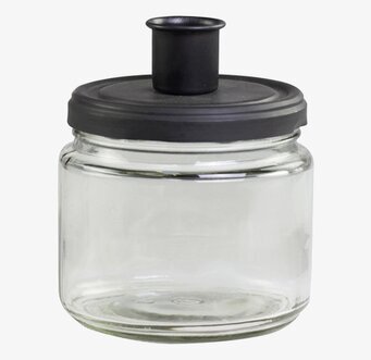 Bild av elegant ljusstake och förvaringsburk i glas