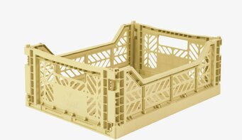 Bild av stilren, banangul förvaringsback med design
