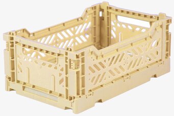 Foto av ljusgul perforerad förvaringsback i plast