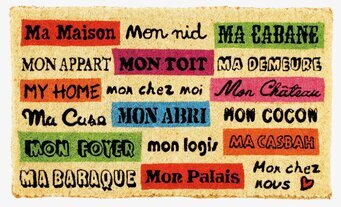 Bild av färgglad dörrmatta med text och naturlig finish