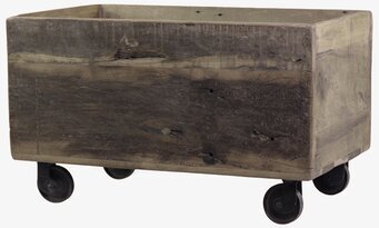 Foto av rustik trälåda på hjul med patinerad yta