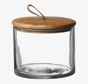 Bild av elegant glasburk med trälock och läderögla