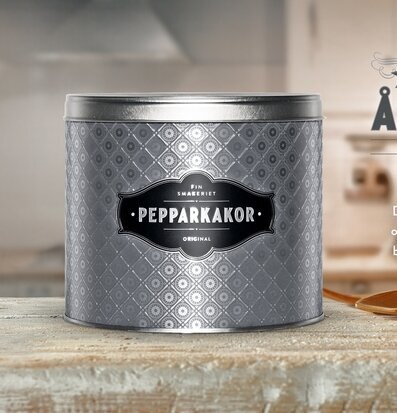 Foto av stilren plåtburk i matt grafitgrå design