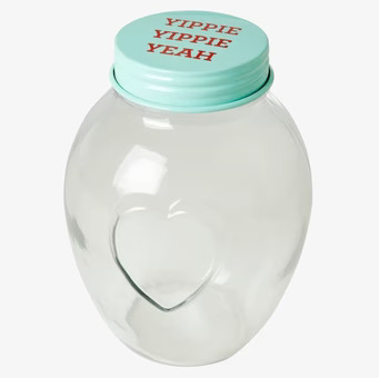 Bild av glasburk med blått lock och ingraverat hjärta