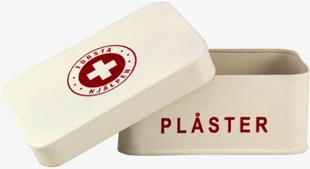 Plåtburk Första Hjälpen från Strömshaga i krämvit färg