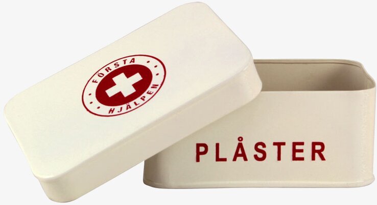Plåtburk Första Hjälpen från Strömshaga i krämvit färg
