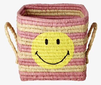 Foto av färgglad förvaringskorg med smiley-design