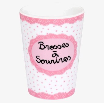 Bild av elegant rosa tandborstmugg med prickigt mönster