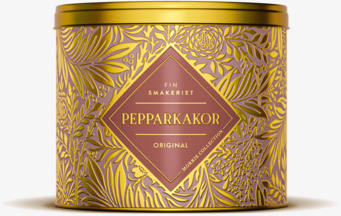 Bild av dekorativ plåtburk med guldfärgat mönster