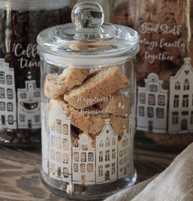 Bild av dekorativa glasburkar med charmiga motiv