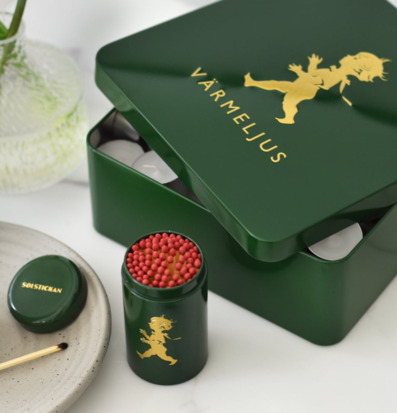 Bild av elegant plåtburk och tändsticksbehållare