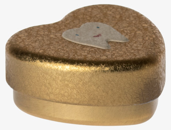 Bild av gyllene hjärtformad plåtburk med tandmotiv