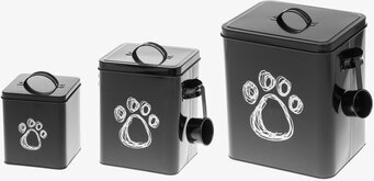 Bild av svarta plåtburkar med tassmotiv och funktionell design