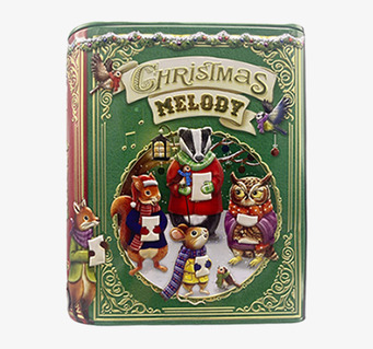 Bild av julinspirerad plåtburk med djur och vintermotiv