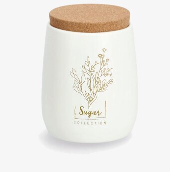 Bild av stilren plåtburk i vitt och guld med korklock