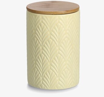 Foto av stilren gul keramisk burk med trälock