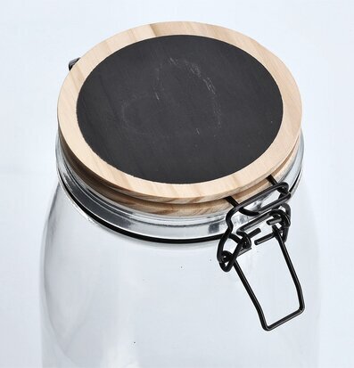 Bild av stilren glasburk med trälock och griffelyta