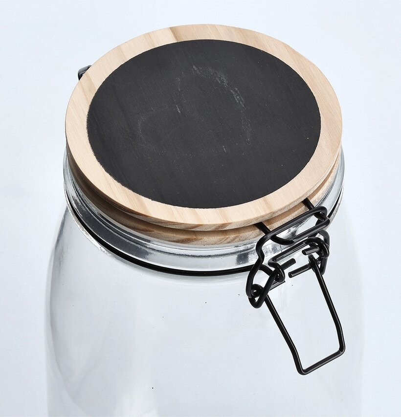 Bild av stilren glasburk med trälock och griffelyta