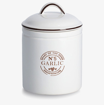 Bild av stilren vit förvaringsburk för vitlök i köket