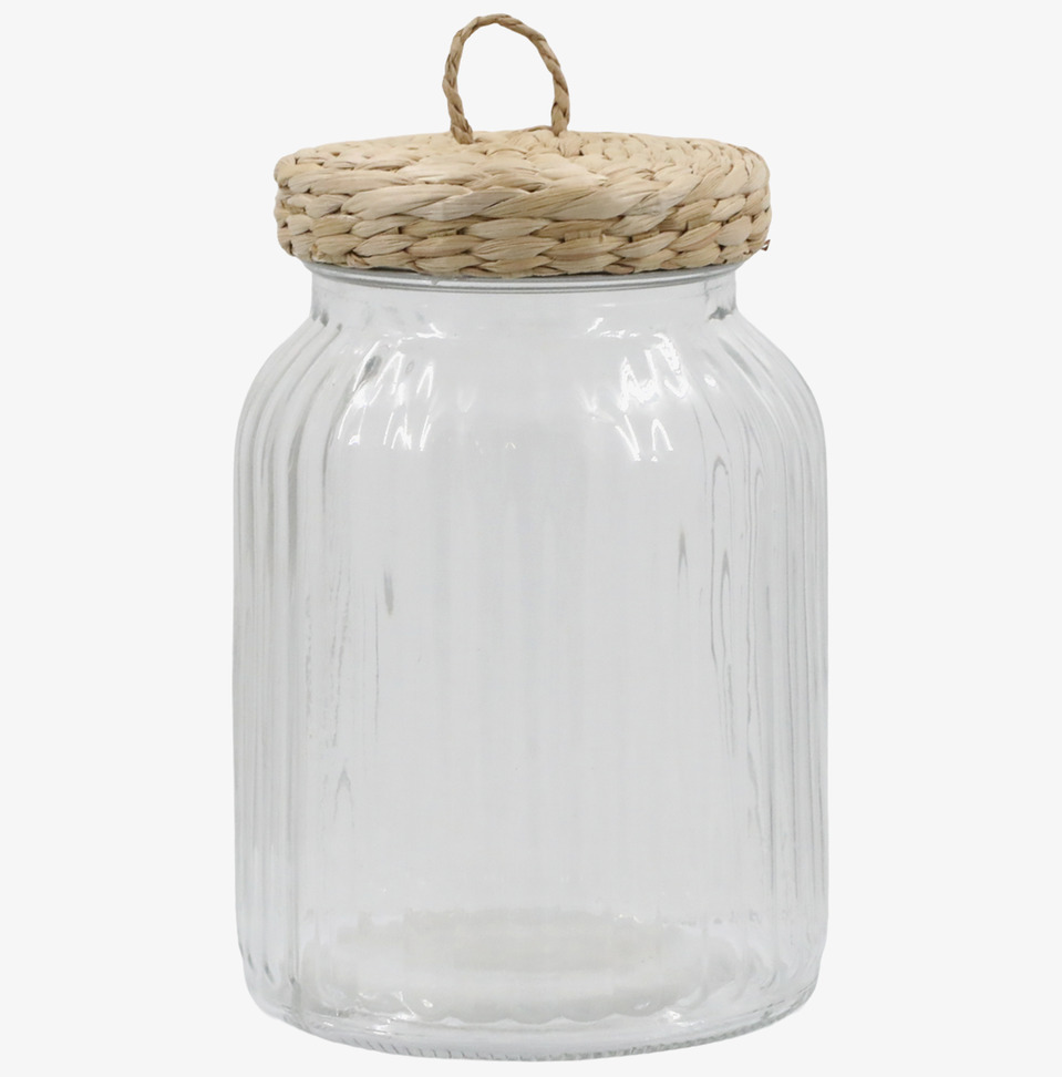 Bild av elegant glasburk med flätat lock och räfflor