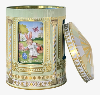 Bild av lyxig påskplåtburk med kanin och gulddetaljer