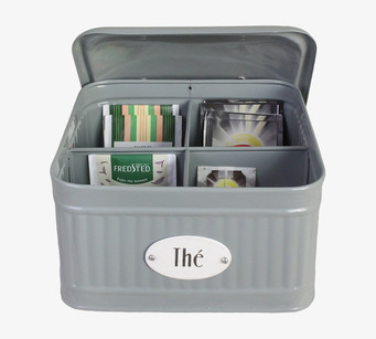 Bild av stilren grön plåtburk med fack för teförvaring