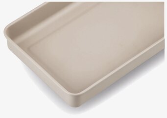 Bild av elegant och funktionell plåtburk i beige design