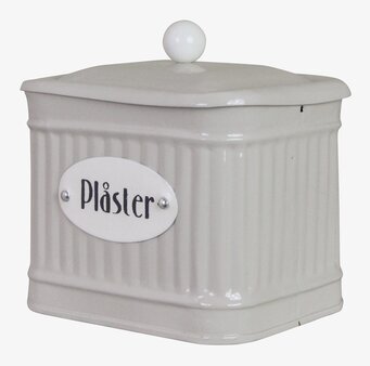 Bild av stilfull beige plåtburk med textur och knopp