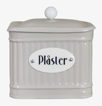 Bild av elegant beige plåtburk för plåsterförvaring