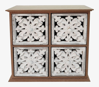 Bild av träskåp med lådor och blommigt mönster i vit dekor