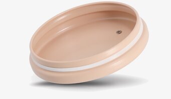 Bild på beige metallock med gummitätning för förvaringsburk