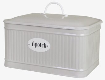 Bild på beige plåtburk med räfflade sidor och metallhandtag