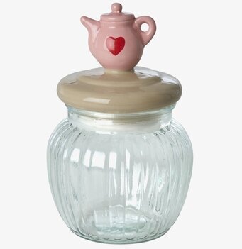 Bild på glasburk med keramiklock och dekorativ minitekanna