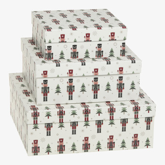 Bild på stapelbara askar med nötknäppare och vintrigt motiv