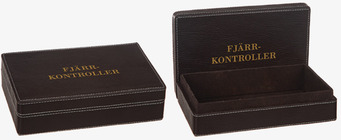 Bild på eleganta lådor för fjärrkontroller i konstläder