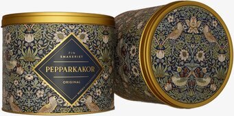 Bild av lyxig marinblå plåtburk med naturinspirerat mönster