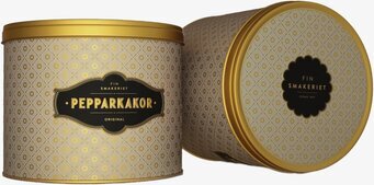 Bild på eleganta plåtburkar i varm beige med gulddetaljer