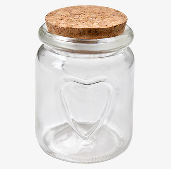 Foto: Transparent glasburk med korklock och hjärta