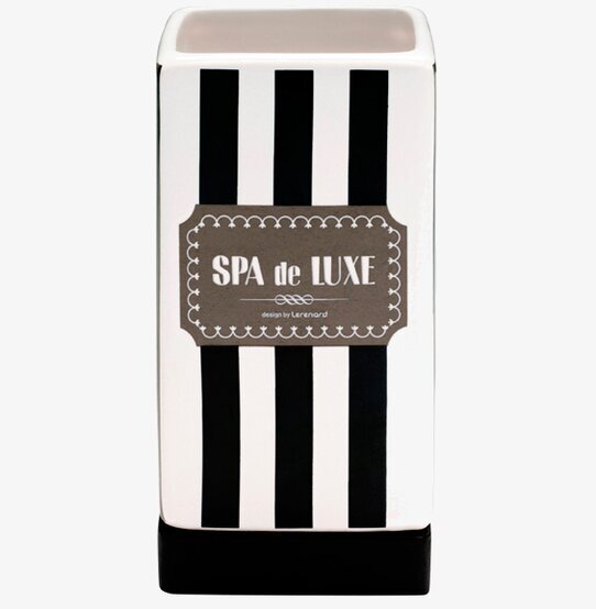 Bild av elegant tandborstmugg med svartvita ränder