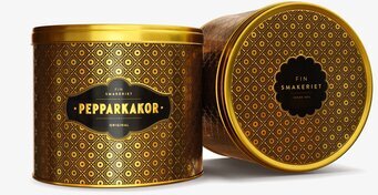 Foto av mörkbrun plåtburk med guldmönster 430g