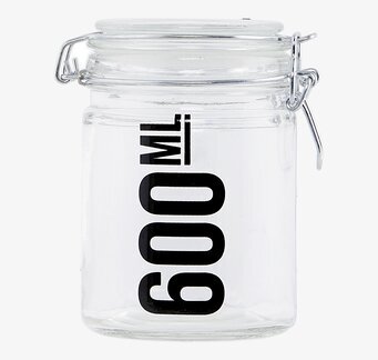 Bild av glasburk med metallklämma och stilren design